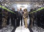 CEA-F4E CSC team standing between a section of the “Helios” supercomputer: from left to right, Jacques David, François Robin, Jacques Noé (CEA) and Susana Clement Lorenzo (F4E).