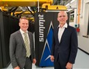 From left to right: F4E Director J. Schwemmer in front of the SUMMIT supercomputer together with Director J. Wells.