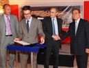 Harry Tuinder, ITER Legal Advisor, Bernard Bigot, High Representative for ITER in France, and ITER Director-General at the time, Kaname Ikeda, look on as the notary public finalises the deed that transfers site responsibility from CEA to the ITER Organization; © AIF Lesenechal July 2010