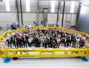 Representatives of F4E, CMIN and SIMIC standing inside the final radial plate which will be used in the manufacturing of the 10 Toroidal Field coils procured by Europe.