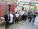 The participants of the ISEPS Factory Acceptance Tests standing in front of the equipment (Image courtesy of OCEM)