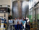 Representatives of the ICAS consortium standing in front of the spool concluding Europe’s contribution the conductor for the manufacturing of the ITER Poloidal Field coils.