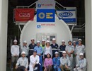 The team involved in the installation of the ACB in front of the component itself