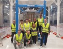 Representatives of F4E, Thales and RFX posing in front of the SPIDER beam source (©Thales_All rights reserved)