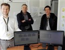 From left to right: R. Campagnolo, C. Lescure & F. Munoz standing by the monitors of the alarm survey system